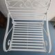 Robust wrought iron armchair