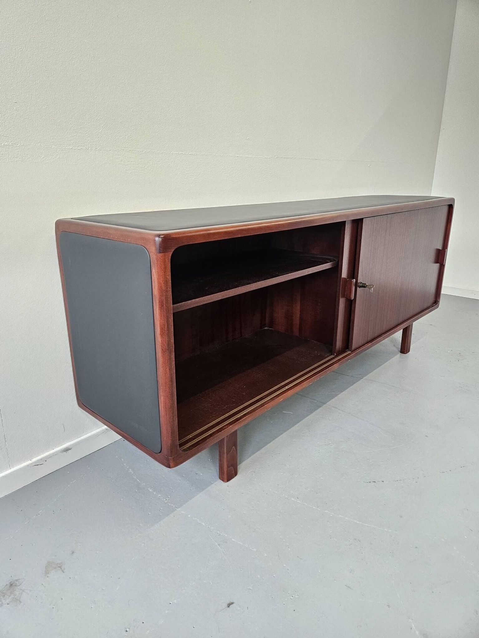 Vintage enfilade in teak and leather, 1970s.