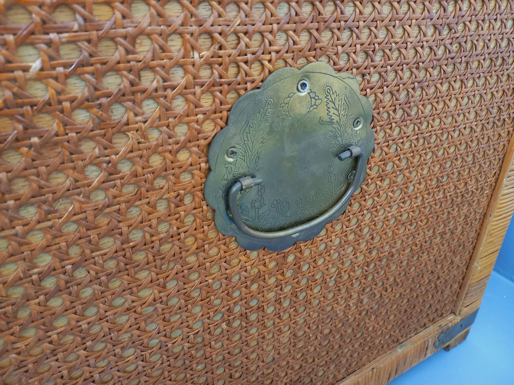 Vintage trunk in wood, rattan, caning, and brass.