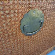 Vintage trunk in wood, rattan, caning, and brass.