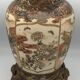 Old satsuma ceramic vase with various decorations mounted on bronze