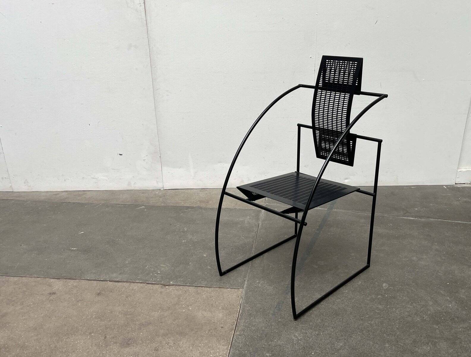 Postmodern black Quinta chair in perforated metal by Mario Botta for Alias, 1980s.