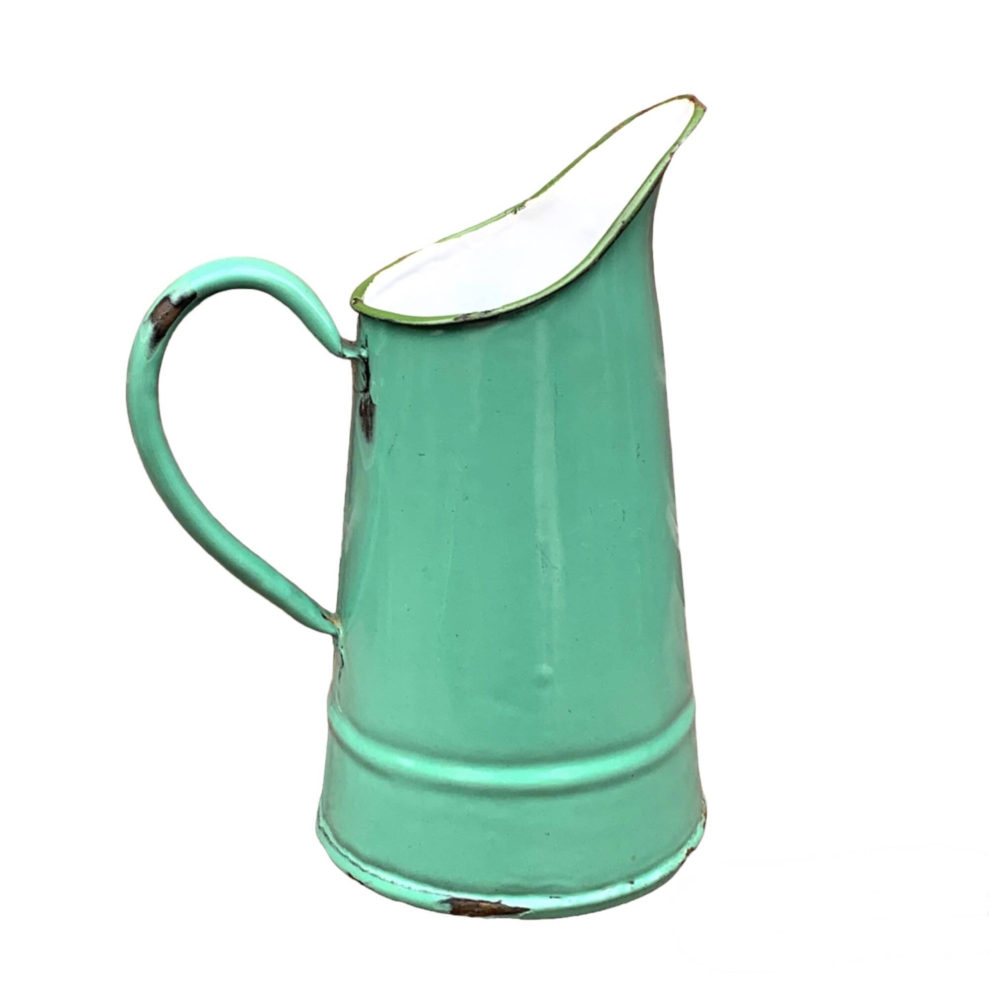 Vintage pitcher in green enameled sheet metal