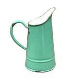 Vintage pitcher in green enameled sheet metal