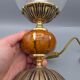 Hollywood Regency bedside lamp in gold metal with a glass globe.