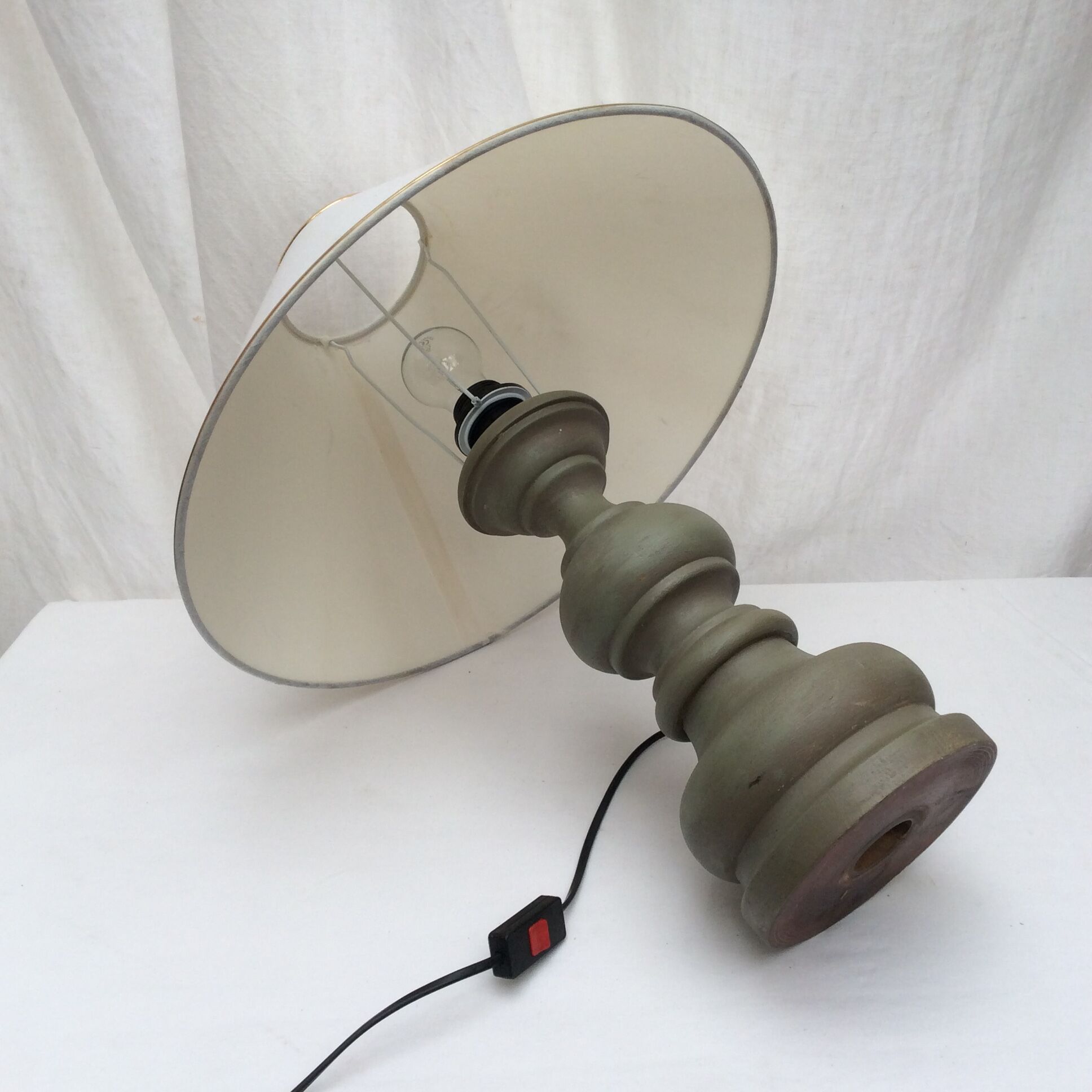 Wooden table lamp in light green color with lampshade