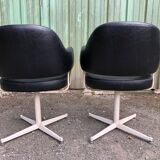 Pair of vintage armchairs in black skai with metal legs.