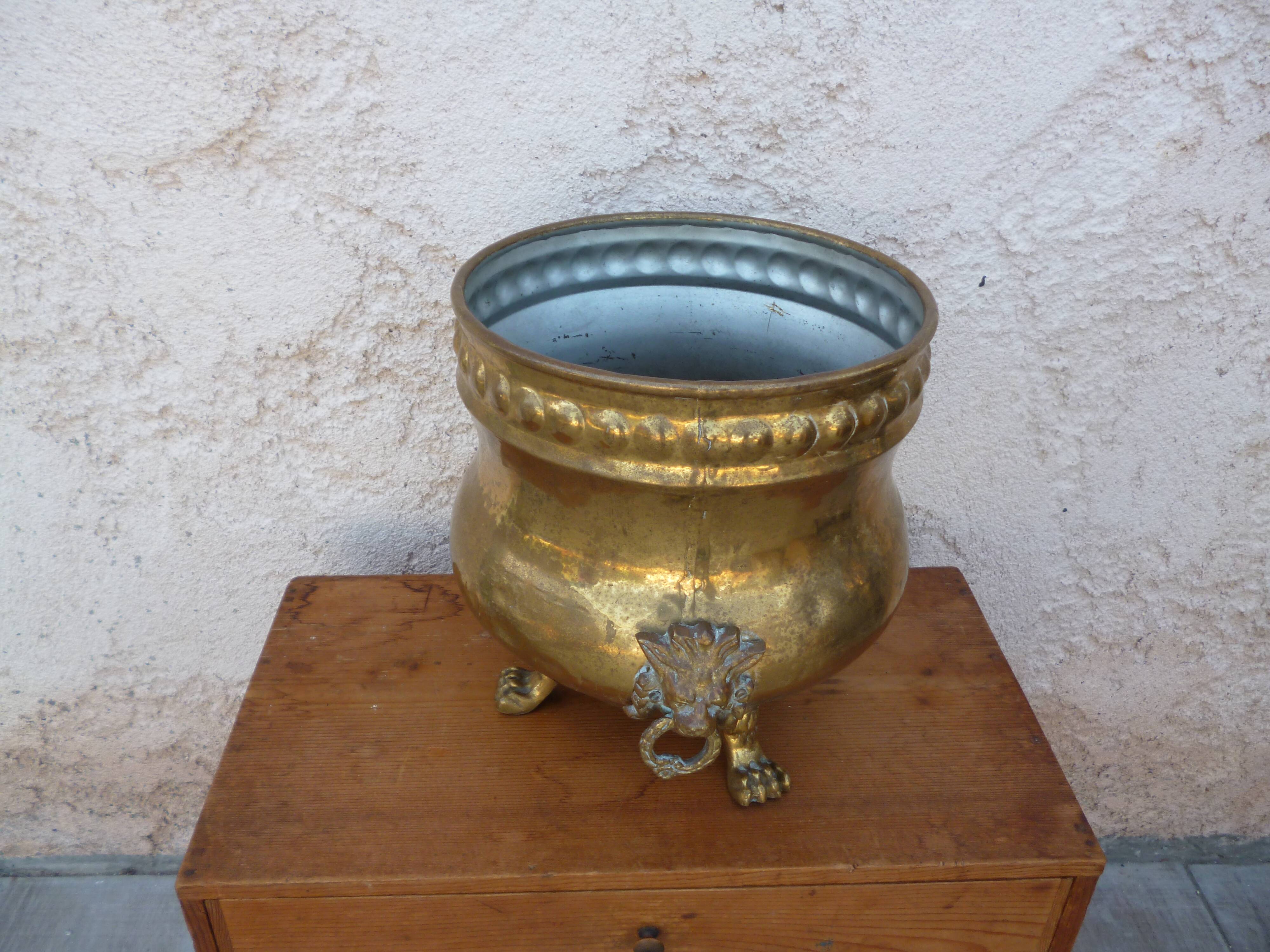 Antique lion heads brass pot cover