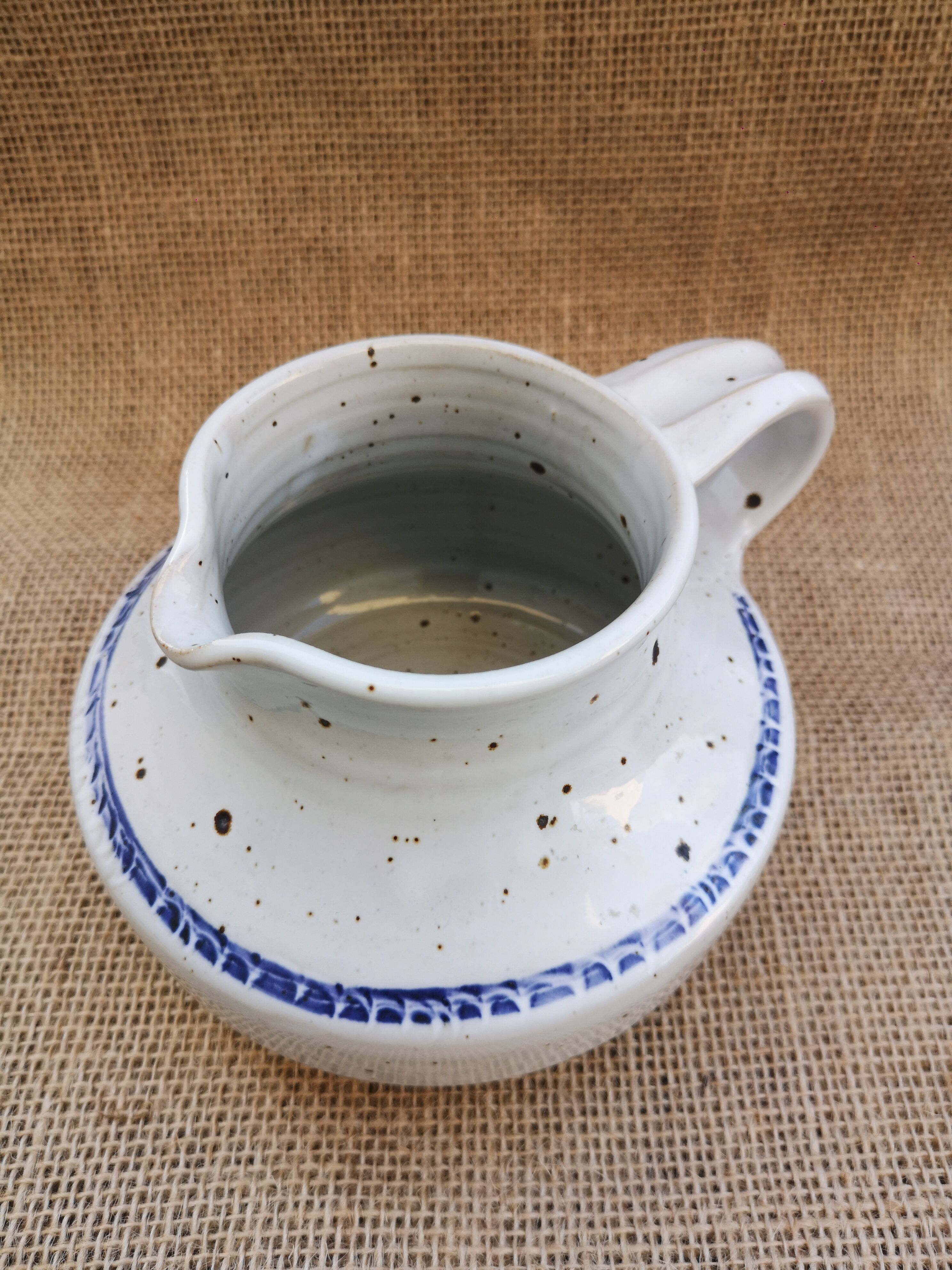 Pitcher in speckled sandstone