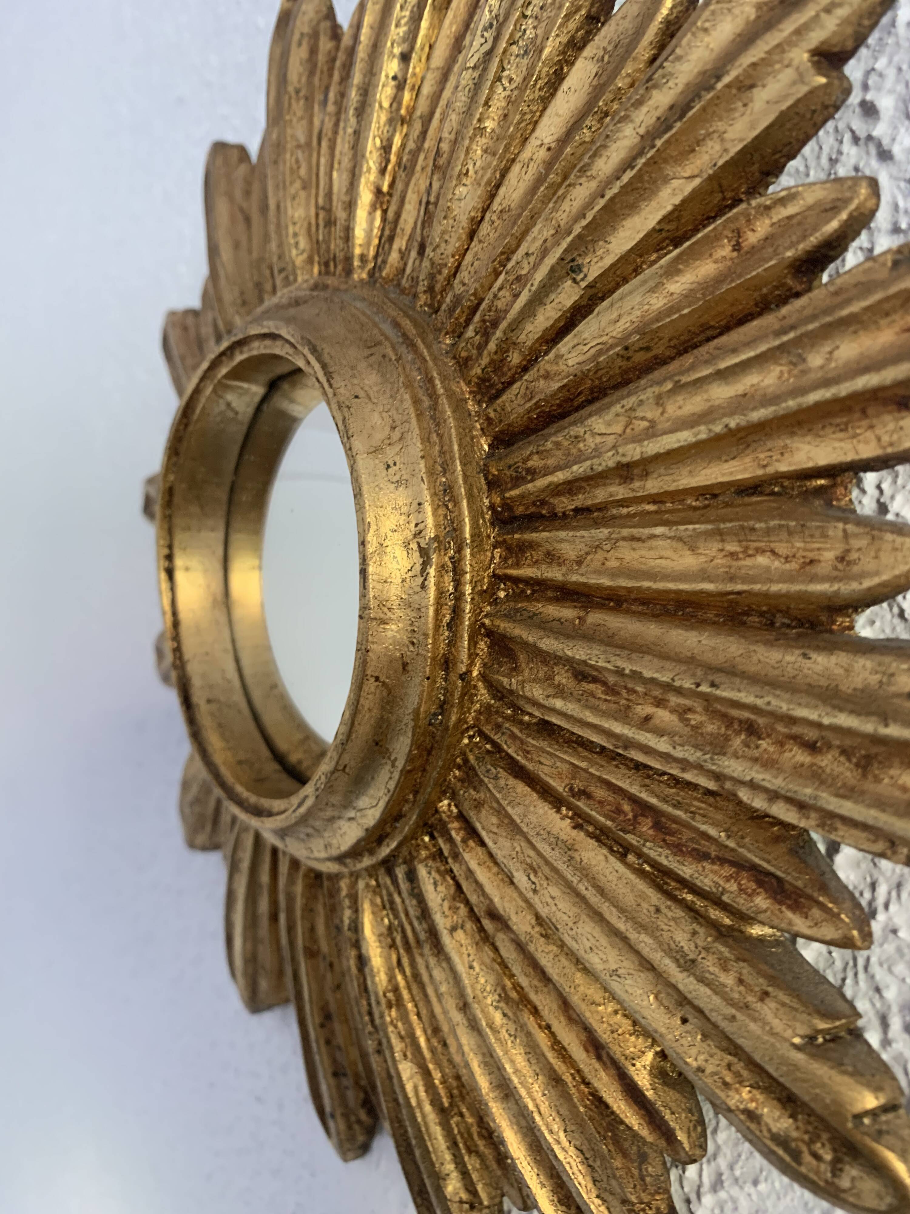 Vintage 1960s sunburst witch's eye mirror in gold - 27 cm