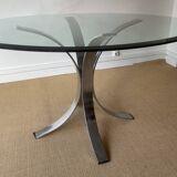 Round glass dining table, circa 1970.