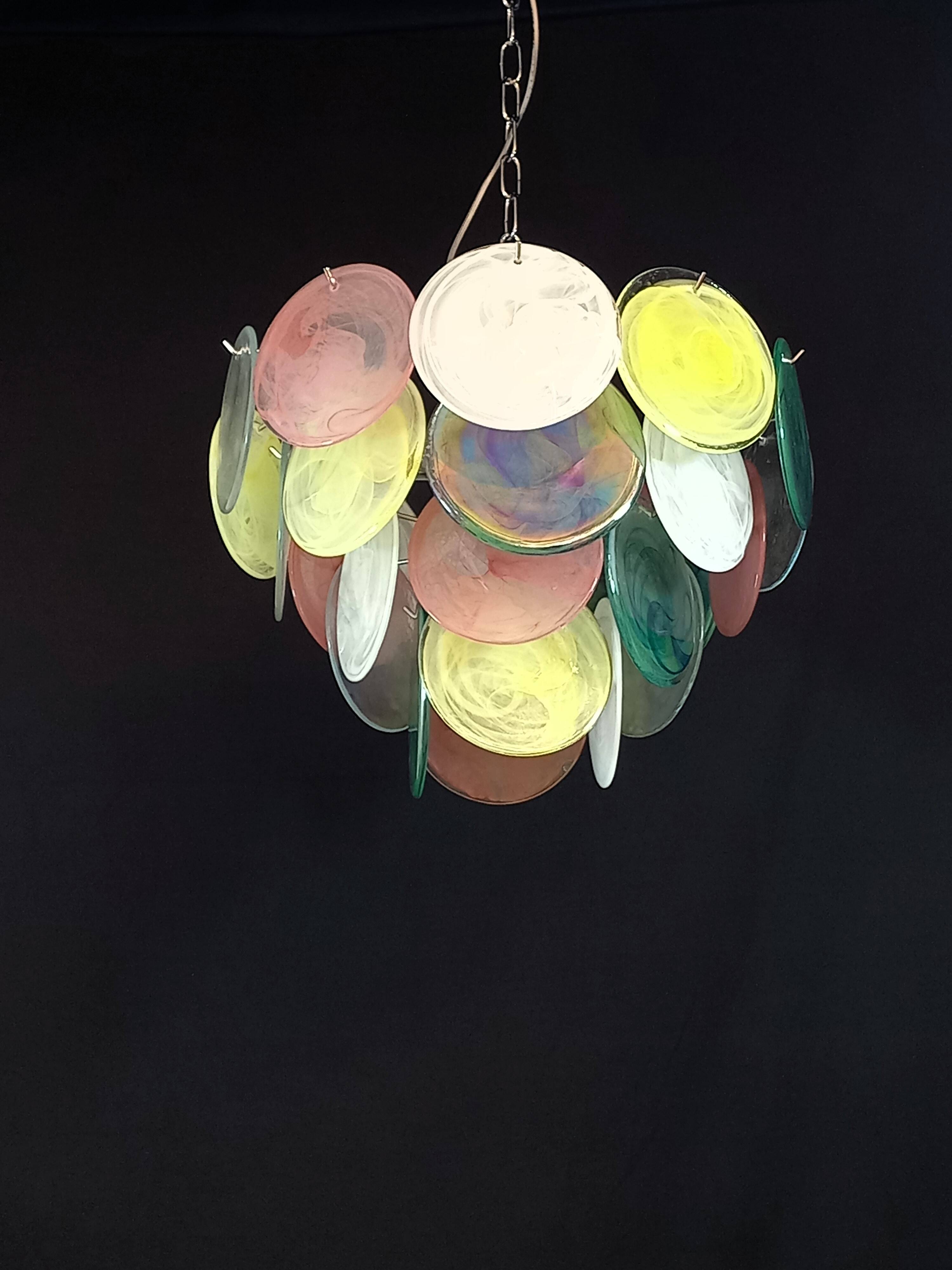 Handcrafted chandelier with Murano glass discs.