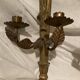 Pair of candle holders in wall, eagle pattern in gilded wood and brass