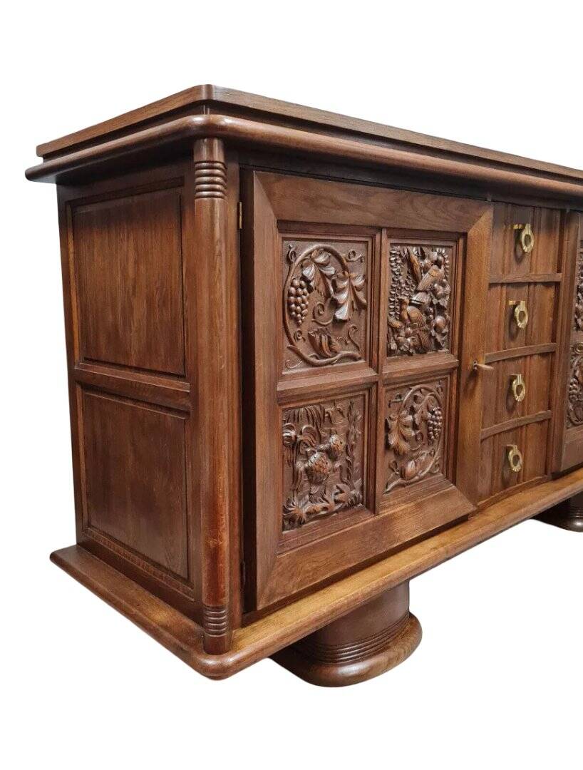 According to Charles Dudouyt: sideboard in a row in solid oak.