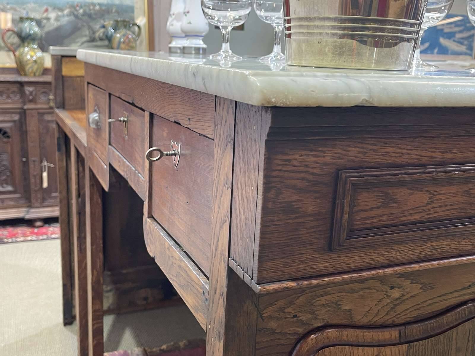 Bar counter in oak, zinc, and white marble from the early 20th century.