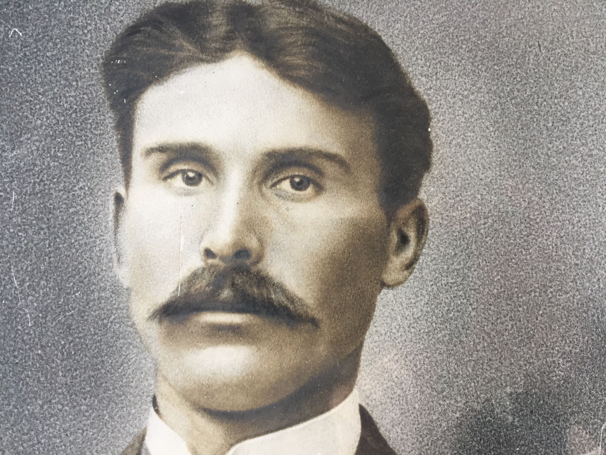 Authentic old photograph portrait of a handsome man with mustache 1920 - 1930