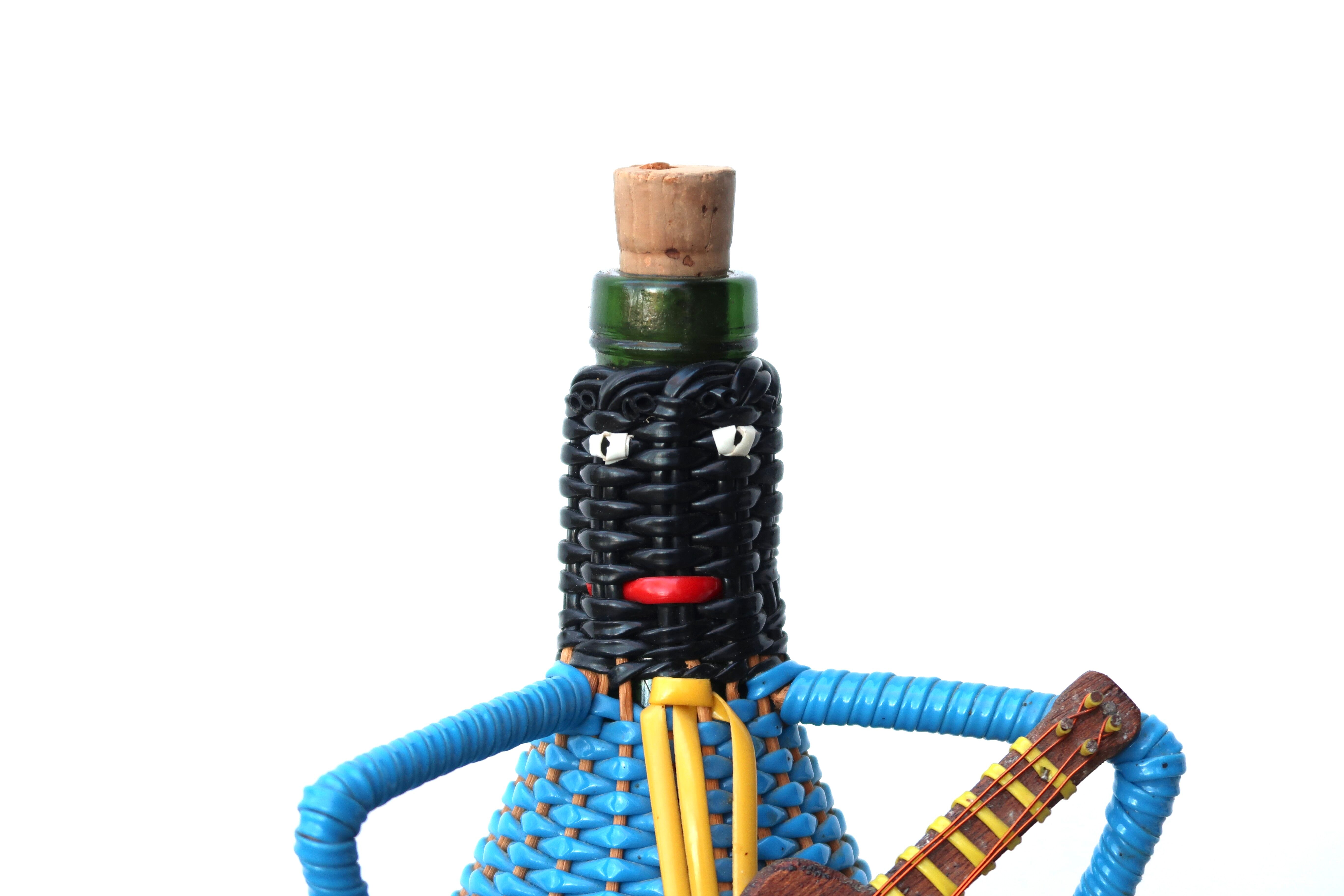 Bottle covered with scoubidou, musician, 60s