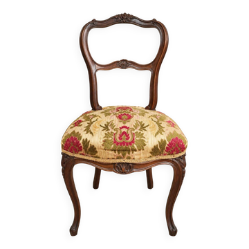 Carved walnut Napoleon III style velvet medallion chair