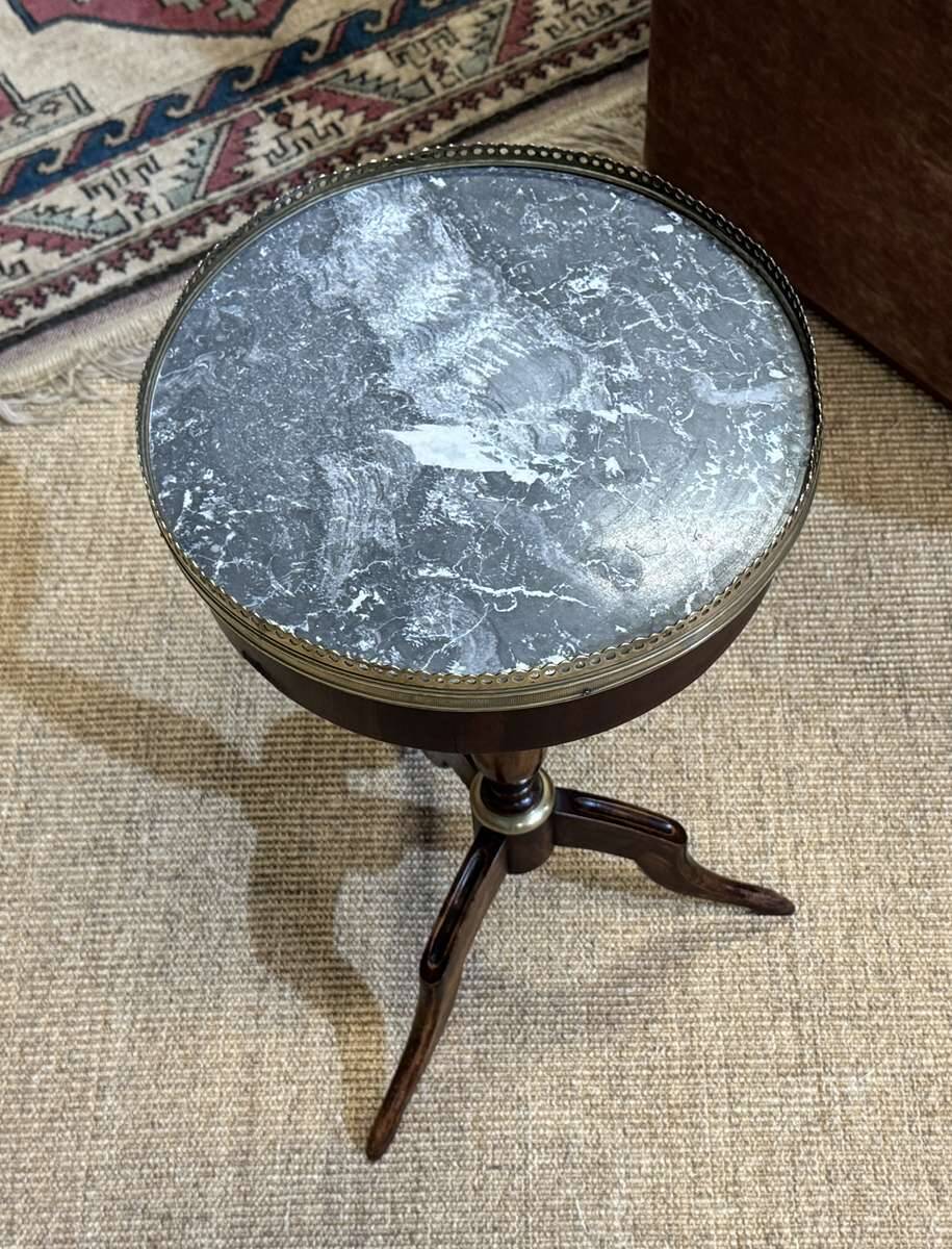 Mahogany gueridon with marble top from the 1950s.