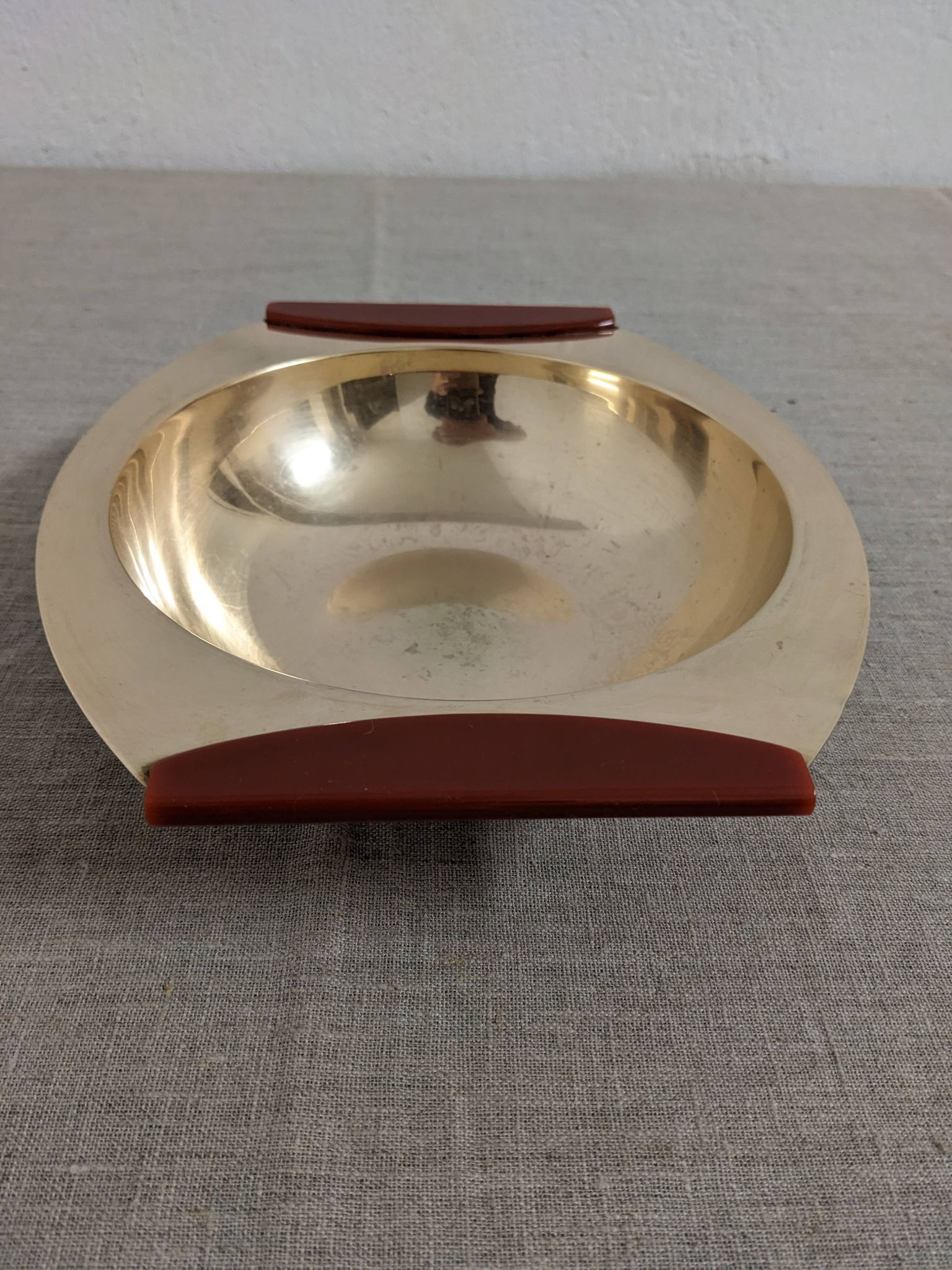 Plates and a brass and Bakelite cut by PM Italy, Italy around 1970.