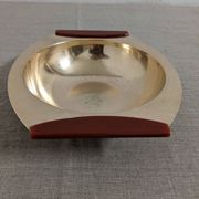 Plates and a brass and Bakelite cut by PM Italy, Italy around 1970.
