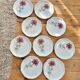 Set of 9 pink daisy dessert plates