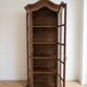 Antique display cabinet in rustic style made of solid wood.