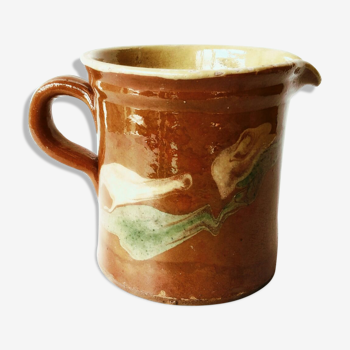 Old pitcher pot in glazed earth