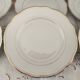 Set of 6 small white porcelain dinner plates with gold trim