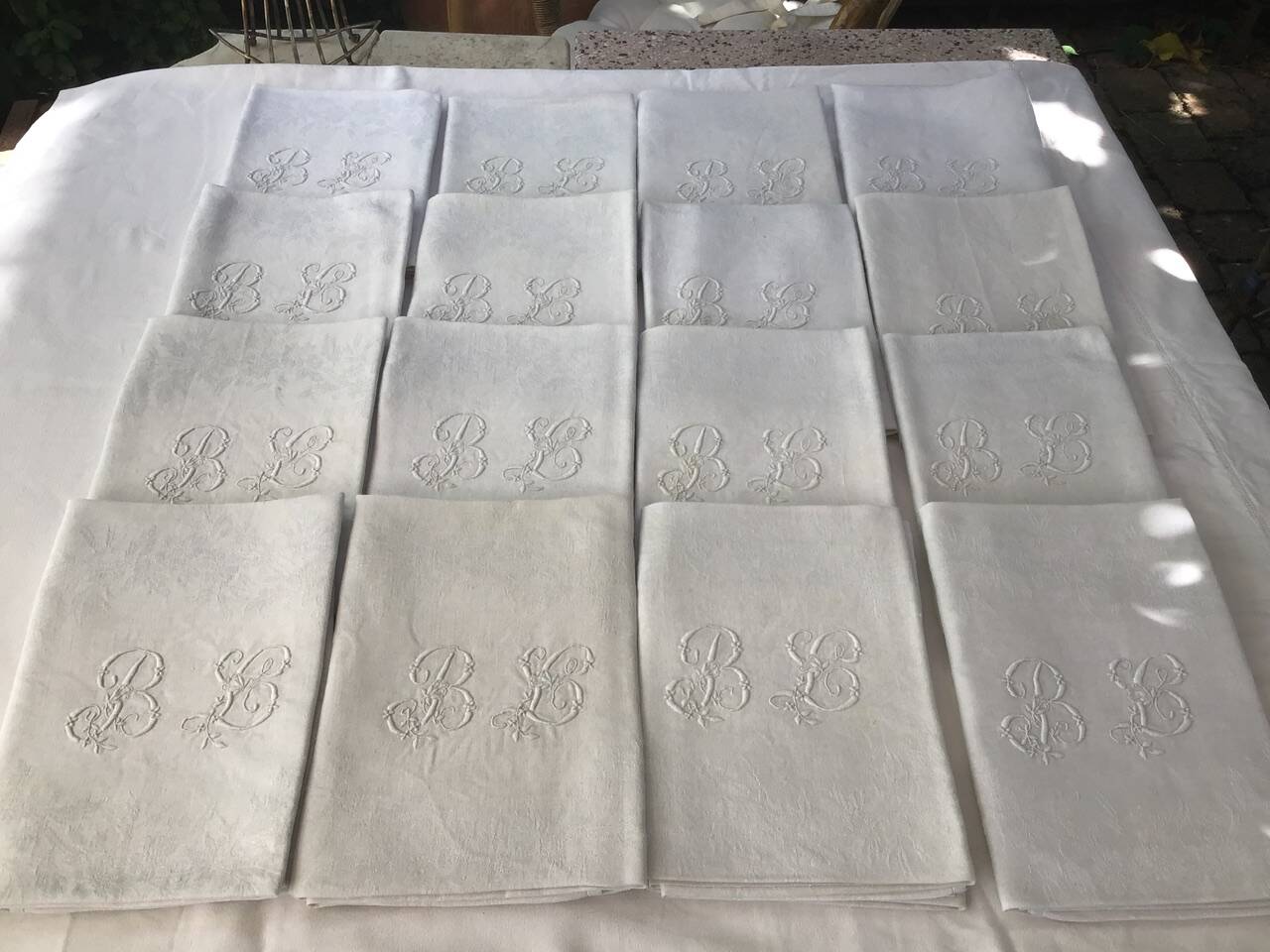 Set of 12 19th century white napkins marked “BL”