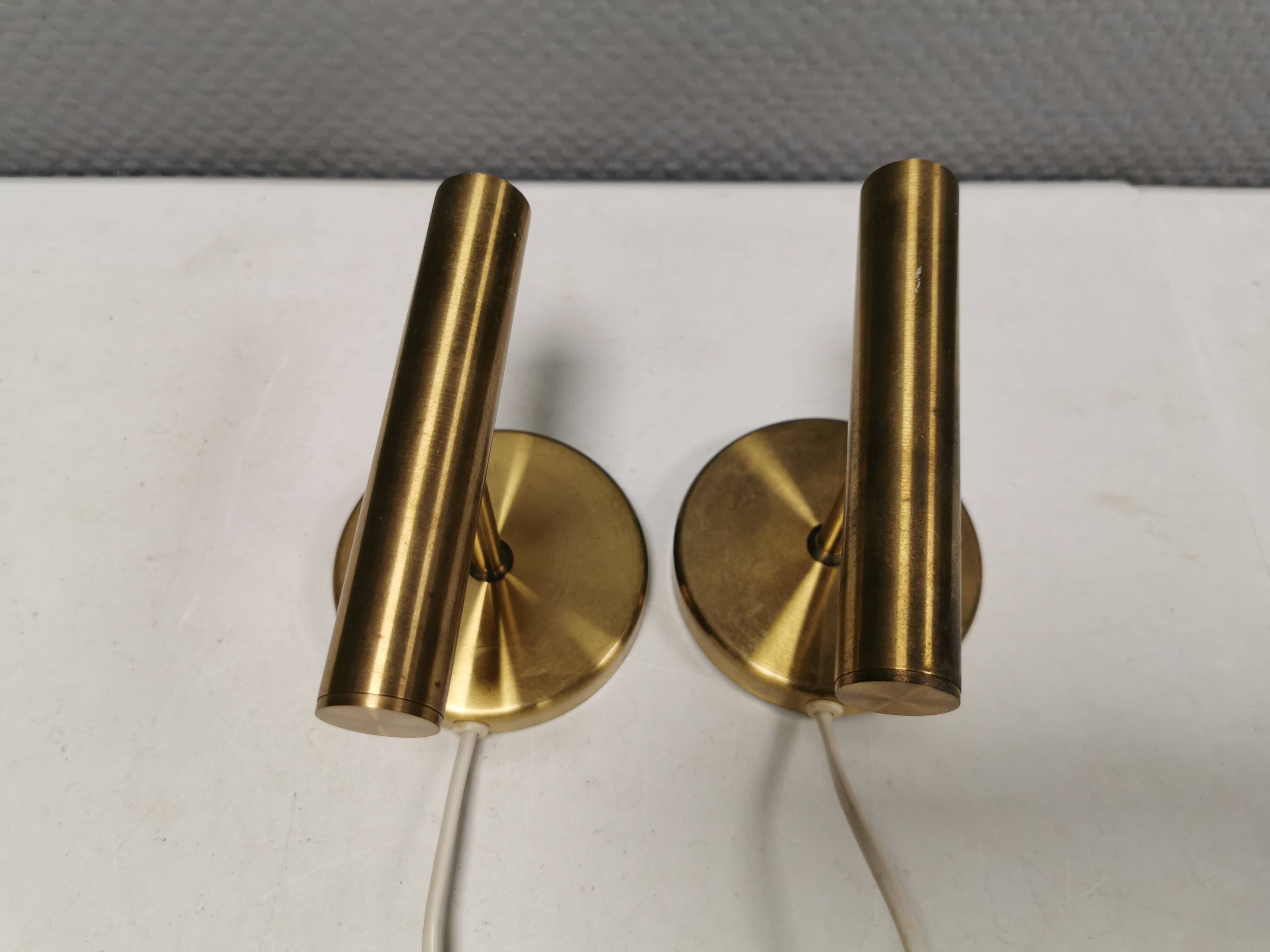 A set of stylish brass wall lamps from Danish Darø