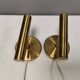 A set of stylish brass wall lamps from Danish Darø