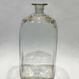 Bouteille en verre décoré de motifs doré
