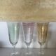 3 iridescent colored champagne glasses