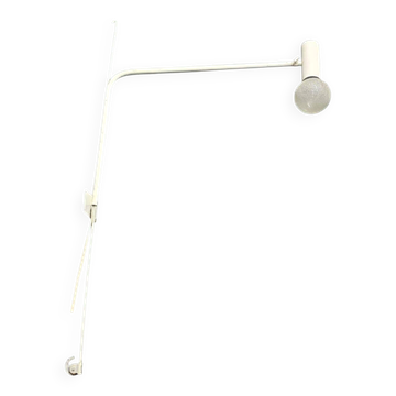 Minimalist metal wall light in the style of Jean Prouvé, circa 1950.
