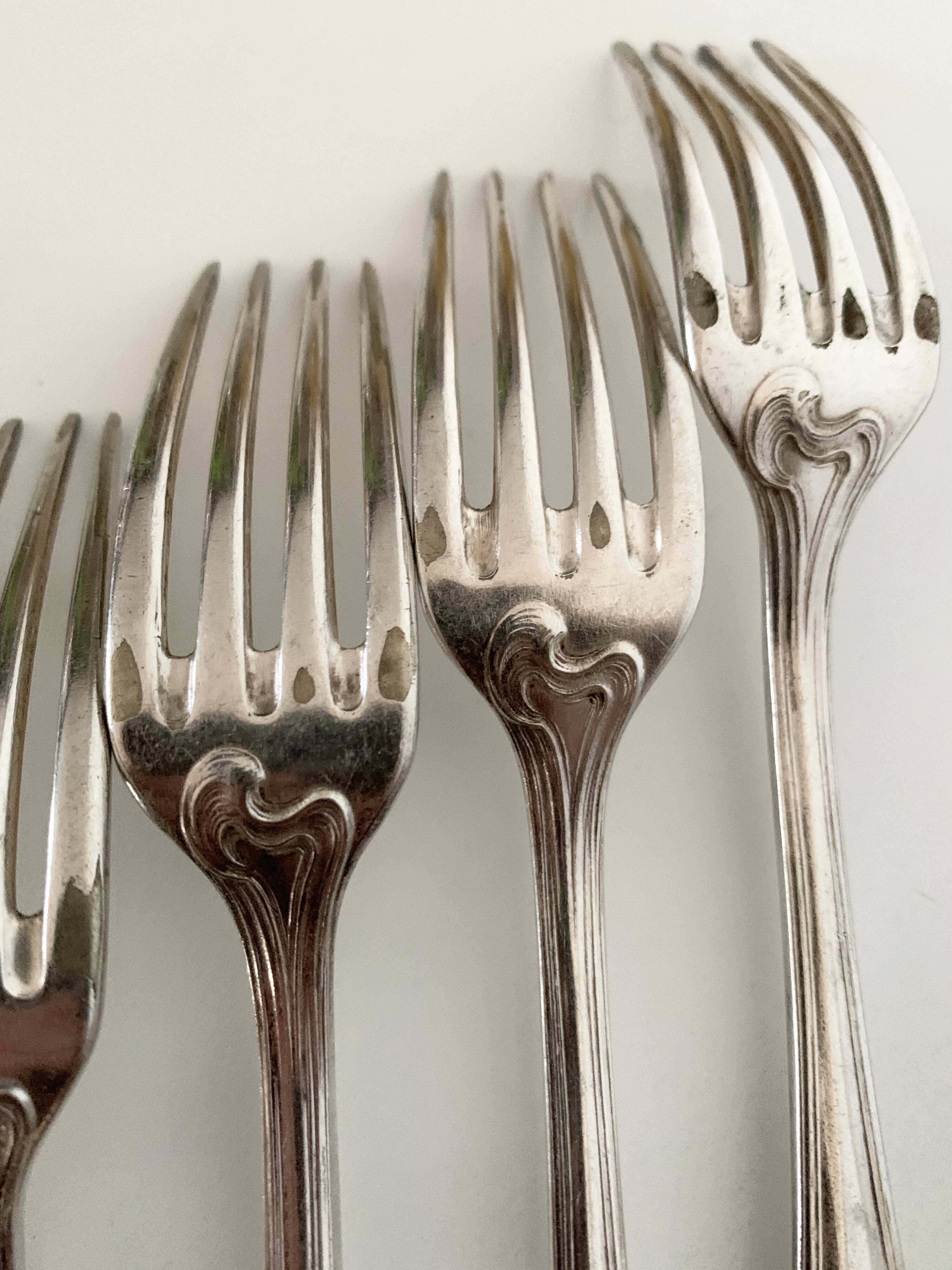 Nine large Ercuis silver-plated forks