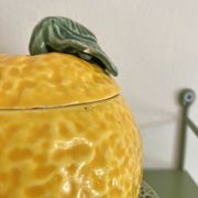 Set of ceramic fruits, a strawberry decanter and two lemon and pineapple jam jars
