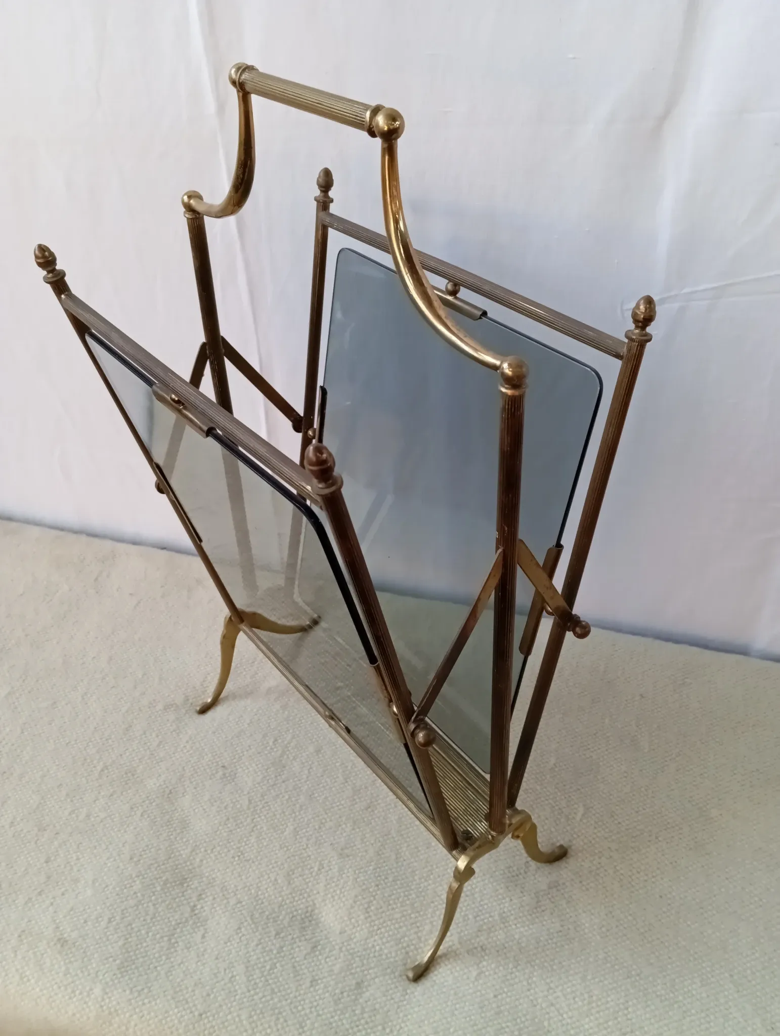 Neo-classical brass magazine rack in the spirit of Maison Jansen.