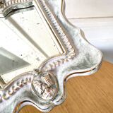 Small antique mirror in cracked ceramic with Commedia dell'Aigle mask decoration