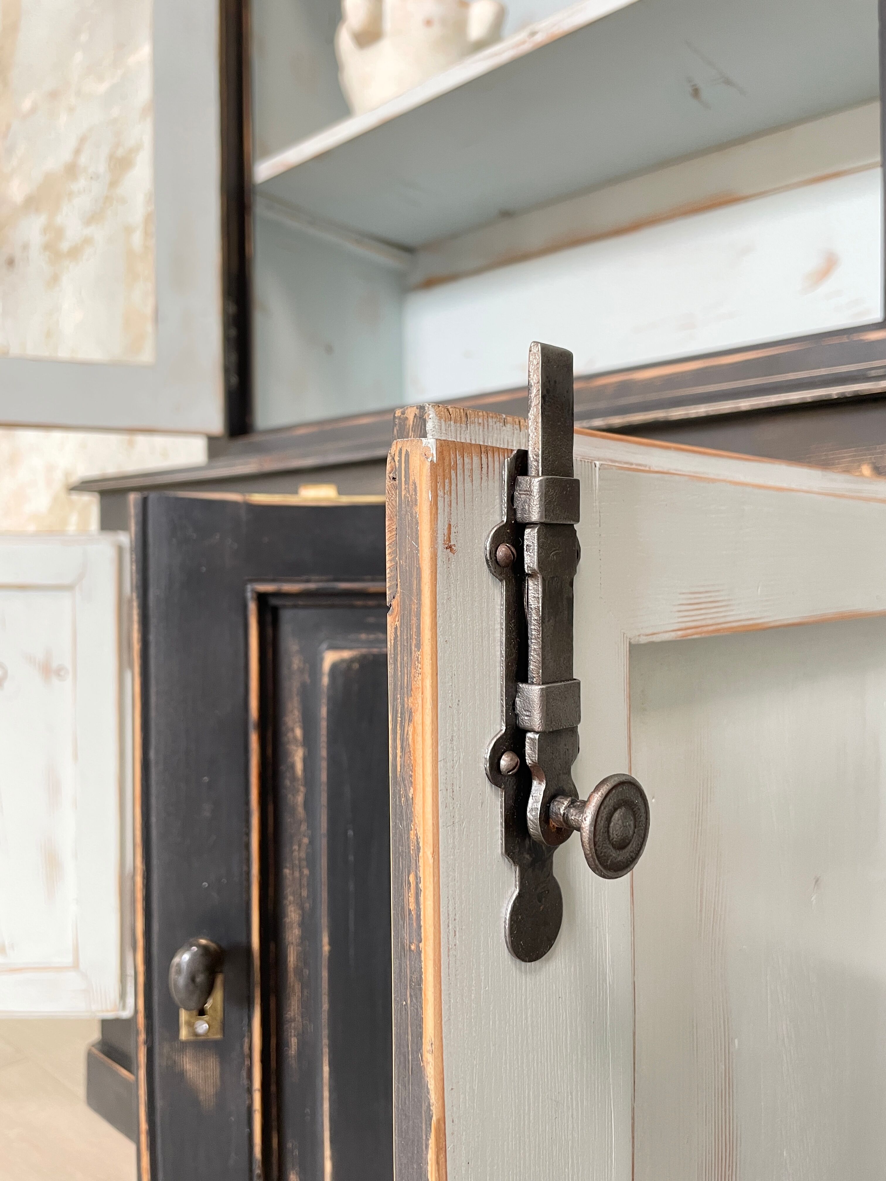 Display cabinet in patinated wood
