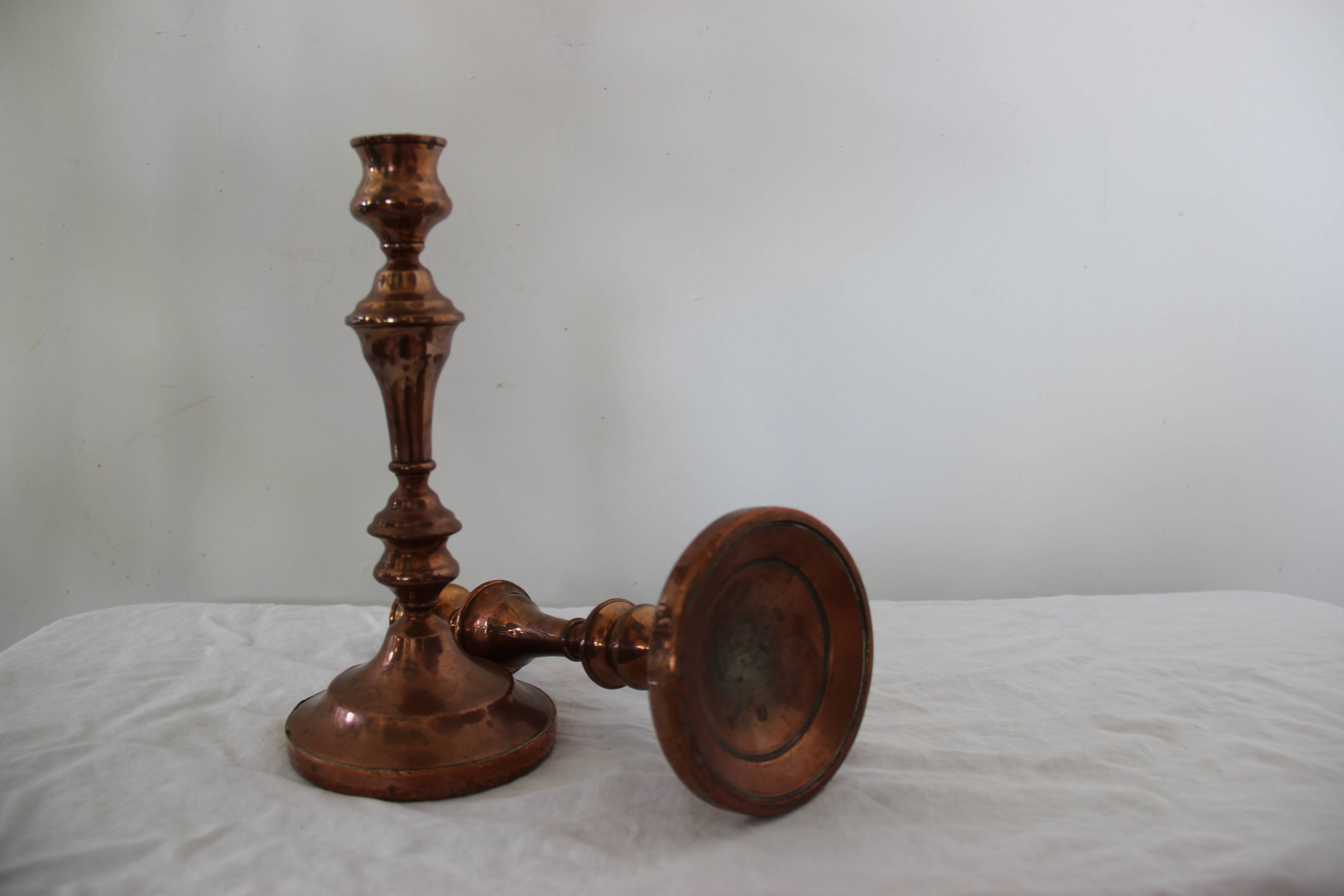 Two copper candle holders