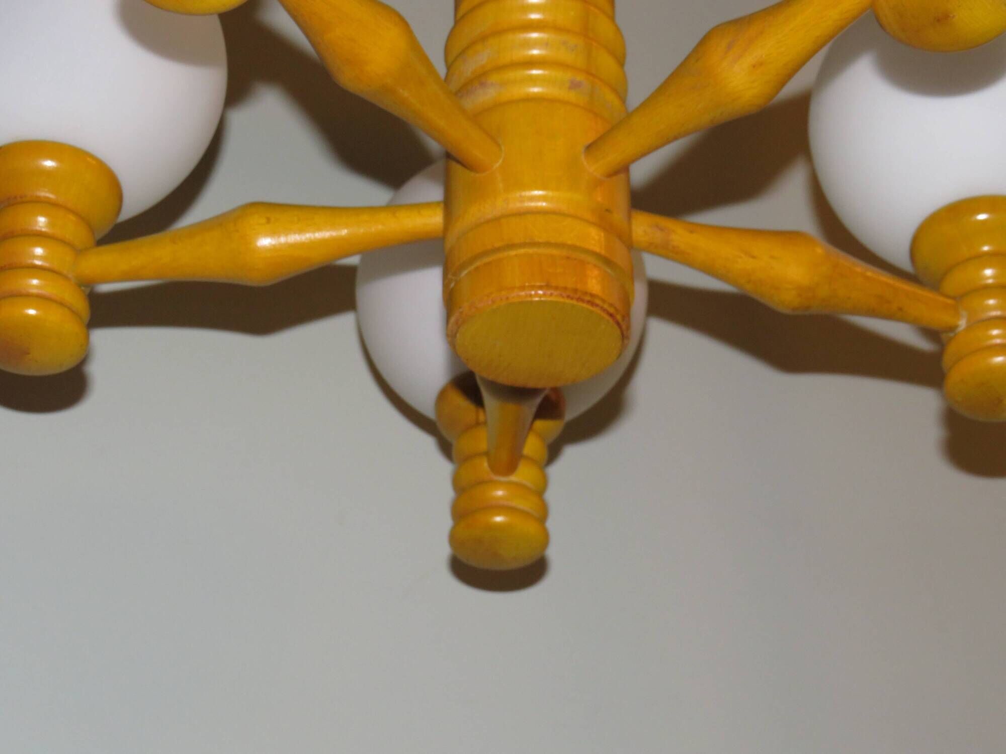 Space age chandelier in 5-arm wood with white frosted opaline glass spheres.