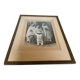 Large frame old photograph of a trio of communicants.