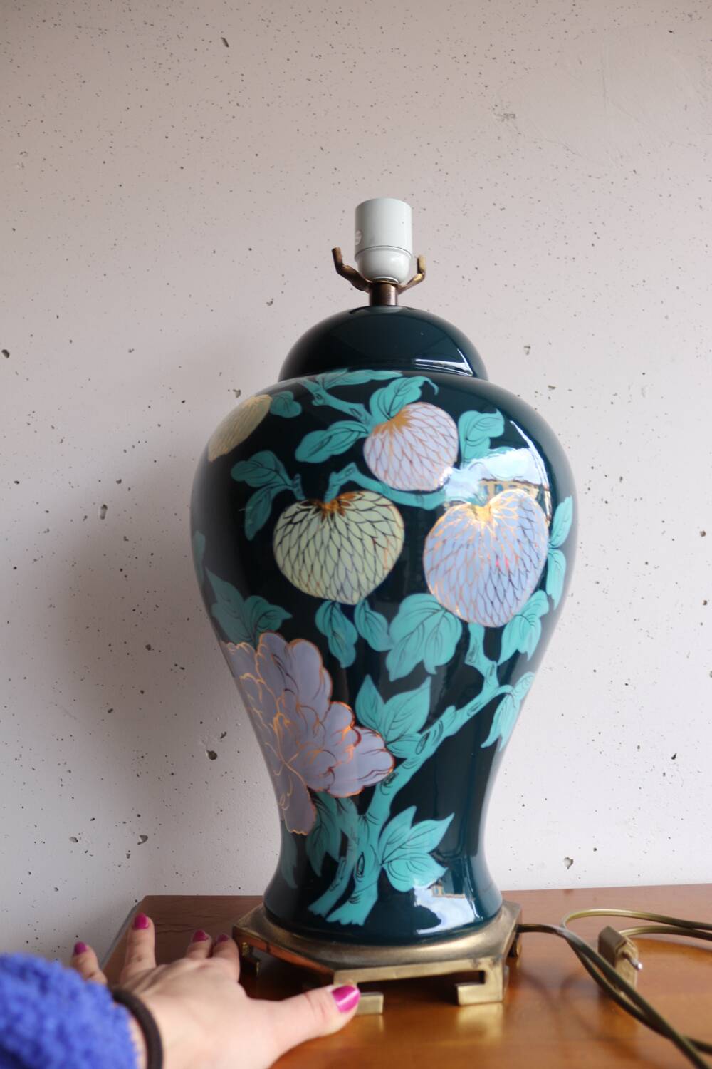 Vintage ceramic lamp with floral decoration.
