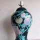 Vintage ceramic lamp with floral decoration.