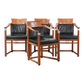 Ensemble de 4 chaises de salle à manger Art Déco en cuir noir de luxe avec accoudoirs.