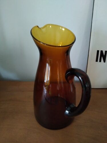 Vintage pitcher in amber glass