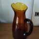 Vintage pitcher in amber glass