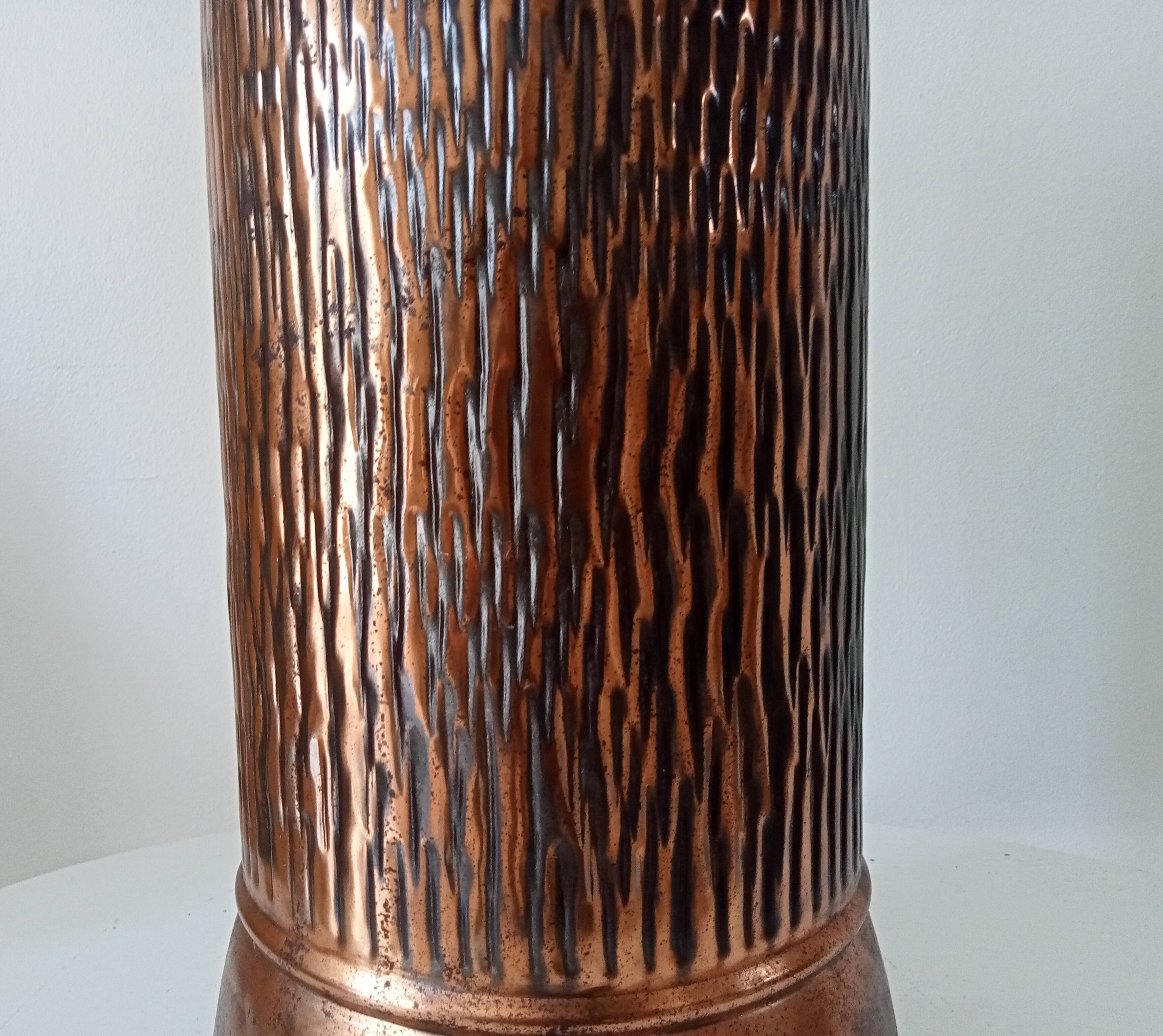 Vintage brutalist umbrella stand in hammered copper with a wood effect.