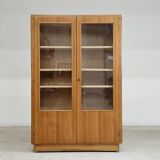 Oak glass-fronted school cabinet 1960